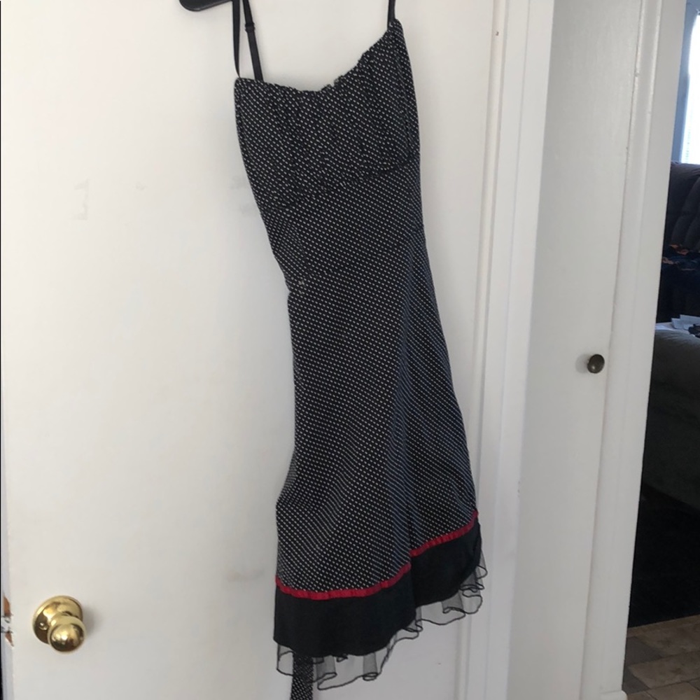 Black dress with white polka dots with red trim